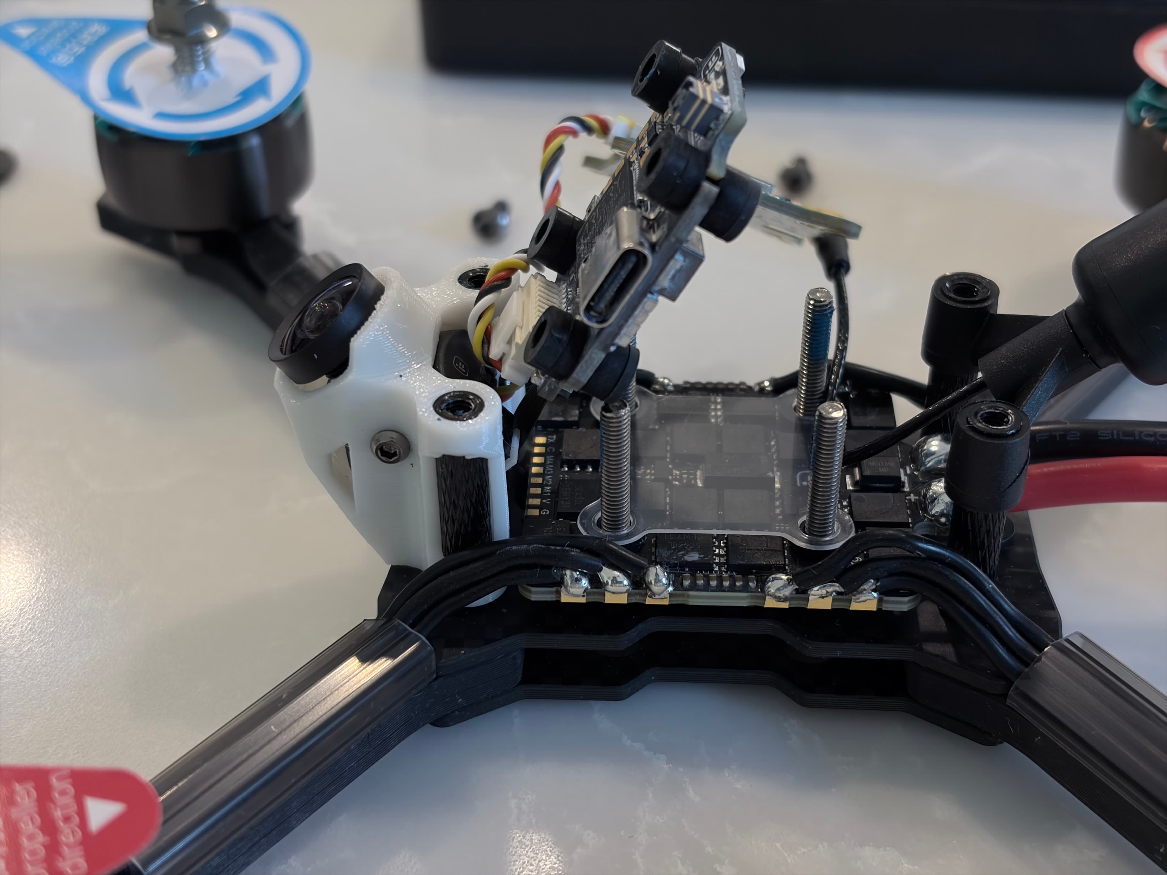 A PNP drone with the flight controller stack exposed, showing where a receiver still needs to be installed